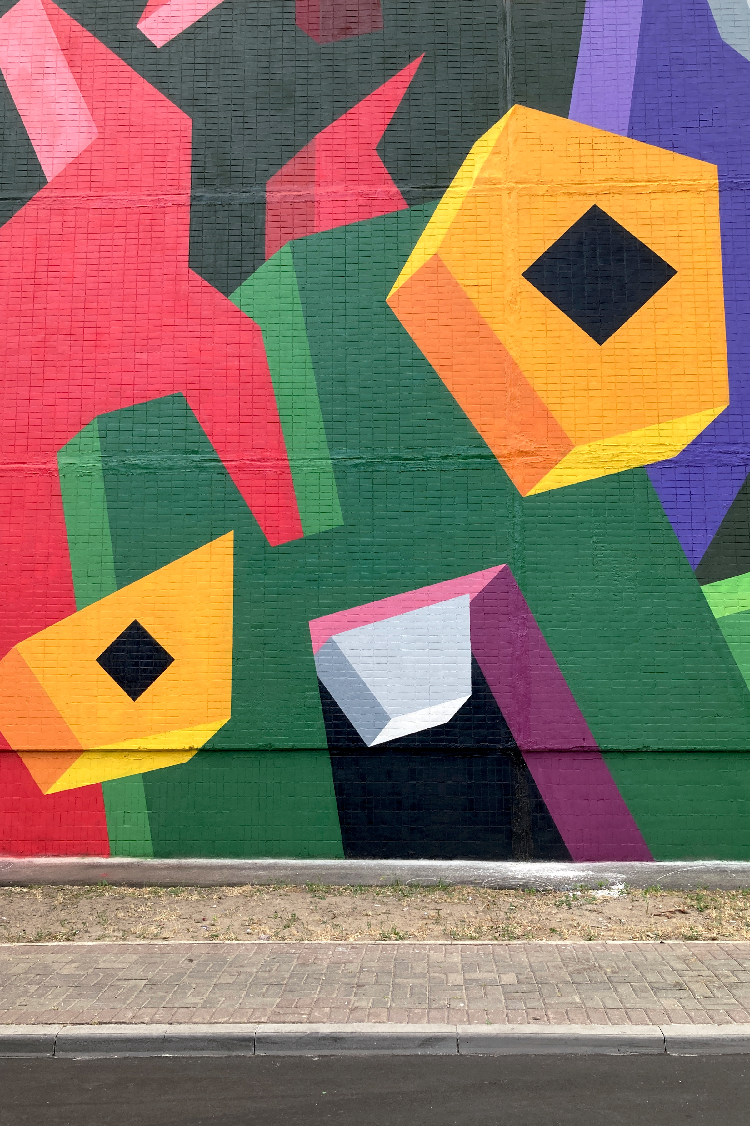 A close-up view of the colorful mural.