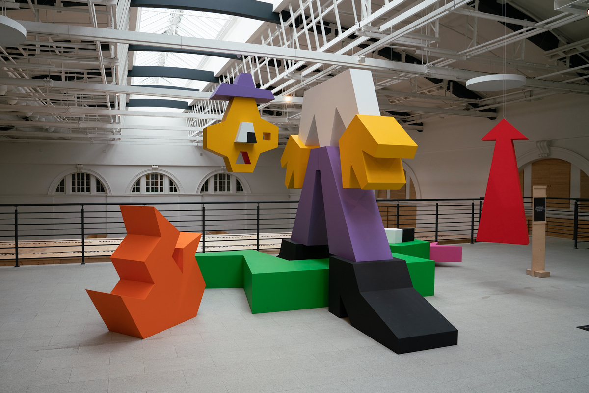 A colorful sculpture in an exhibition hall.