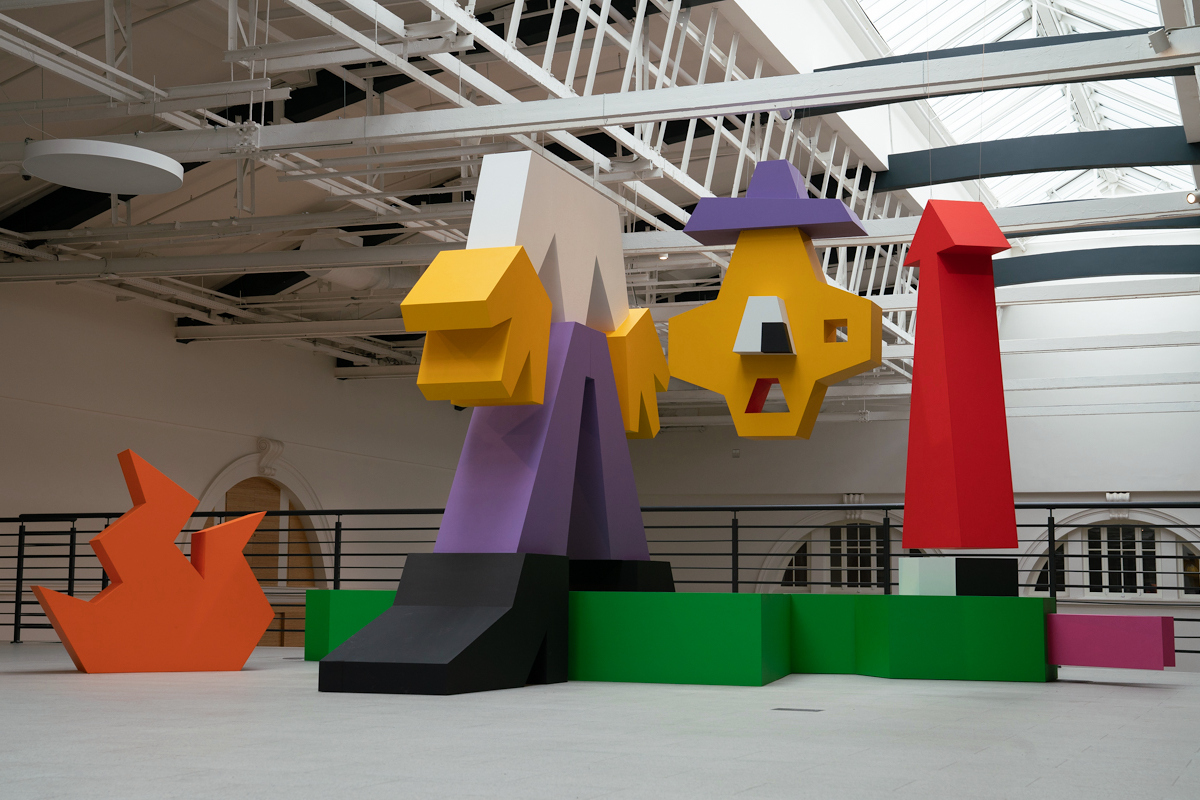 A colorful sculpture in an exhibition hall.